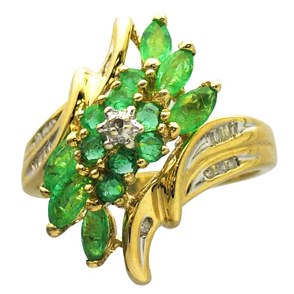10K Gold Emerald Ring With Diamond Accents Add a bit of color to your jewelry collection. The natural color of the emeralds a wondrous touch to the contrasting diamond accents