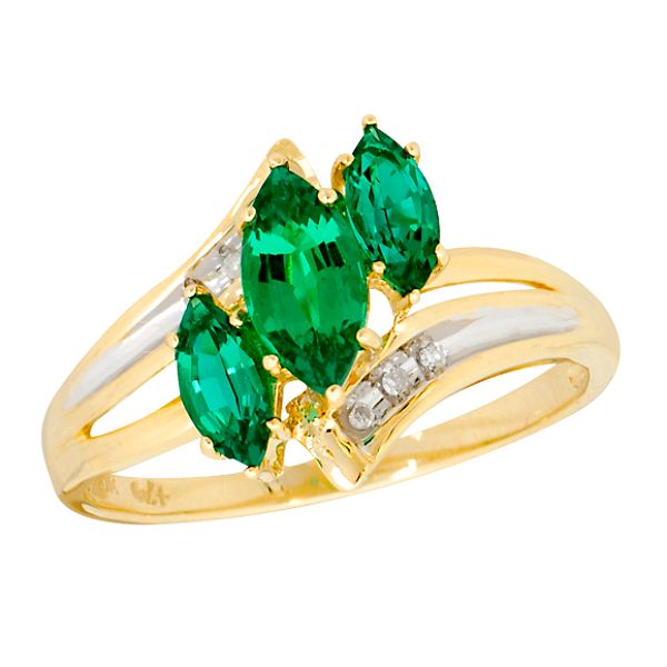 Triple tantalizing beauty radiates from this pretty ring. Three lab-created marquise emeralds (8x4-6x3mm) takes center stage while diamond accents add just the right touch to this 10K yellow gold ring. Gemstones are lab created All Ladies rings are size 7 unless otherwise noted. Most colored gemstones are treated to enhance their natural appearance. Some treatments are not permanent and may require special care. See Buying Guide for details.